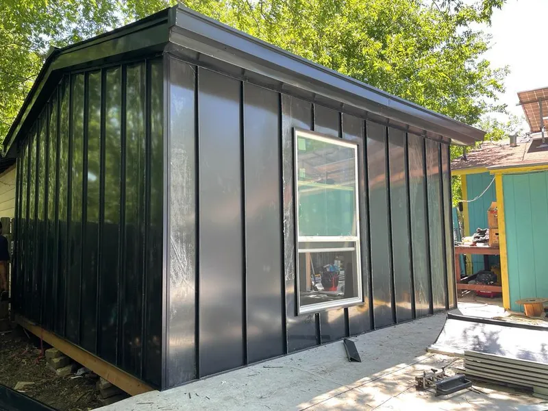 Black standing seam metal wall panels for Roof Inspection in Longmont