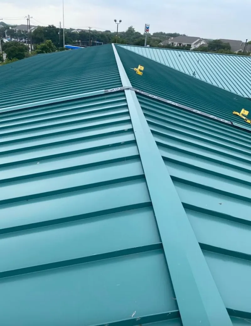 Green commercial metal roof ridge and valley for Metal Roof Repair in Longmont